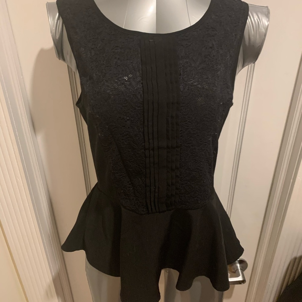 Adorable women’s peplum top with lace detail